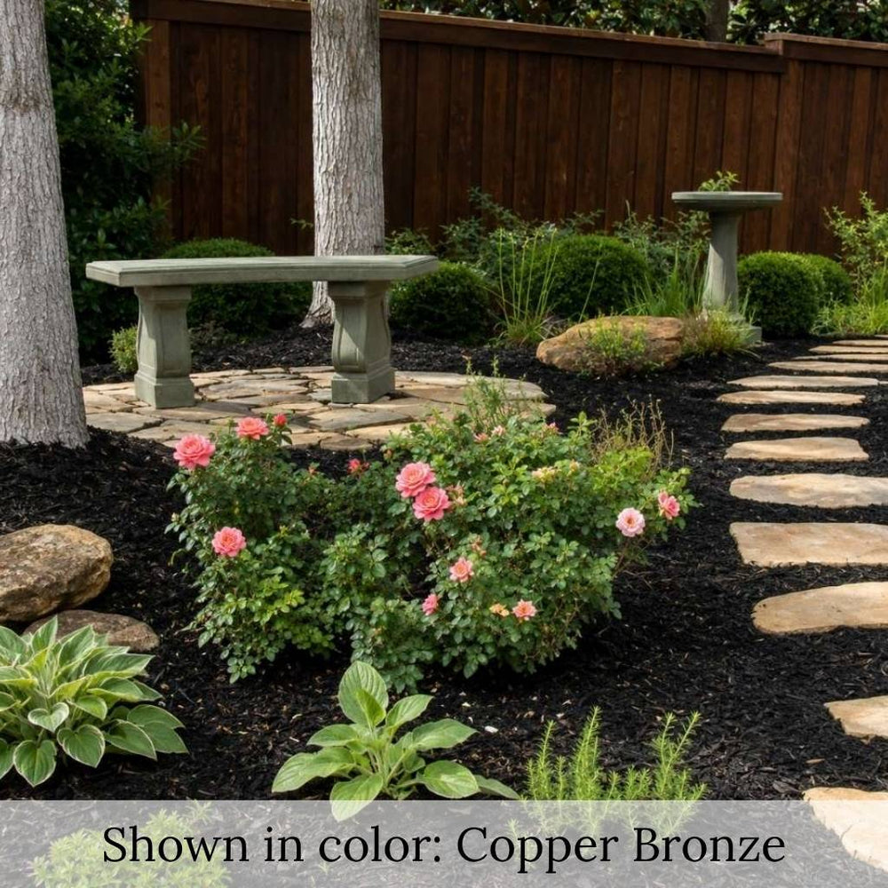 Campania Arles Bench in copper bronze in lush garden.