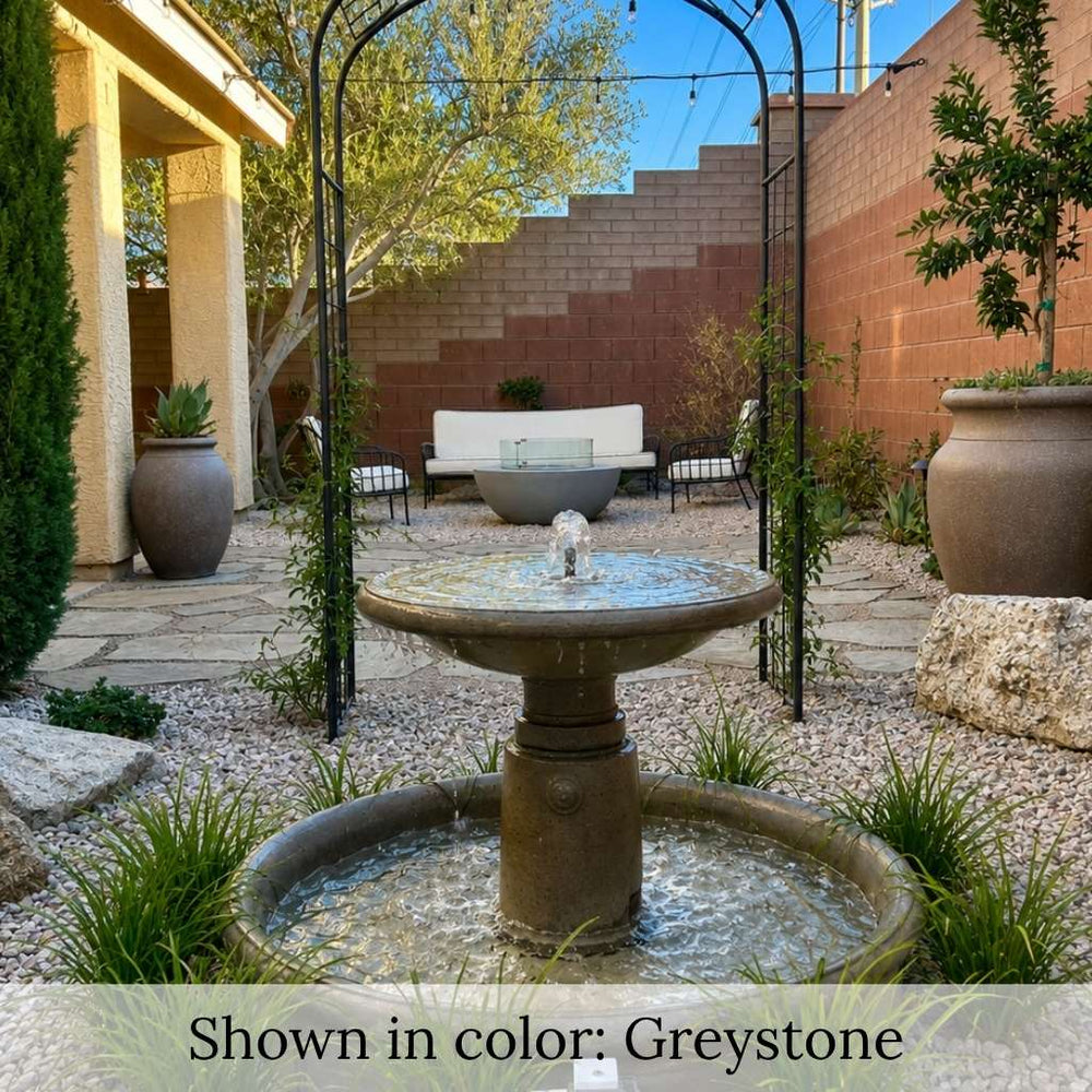 Esplanade Fountain in action in a beautifully landscaped backyard rock garden.
