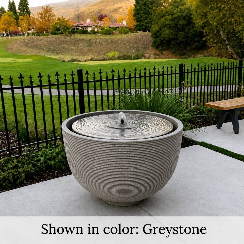 Campania International Alta Girona Fountain Greystone on backyard patio.