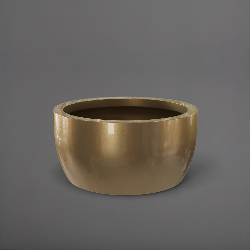 Casablanca Bowl Fiberglass Planter in gloss metallic gold against gray background.