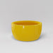 Casablanca Bowl Fiberglass Planter in gloss saffron against gray background.