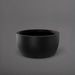 Casablanca Bowl Fiberglass Planter in matte black against gray background.