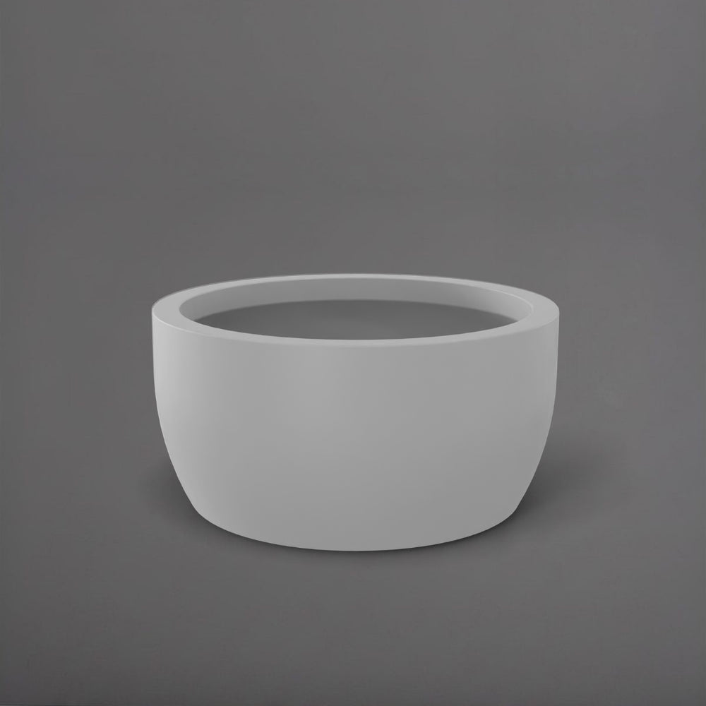Casablanca Bowl Fiberglass Planter in matte cement grey against gray background.