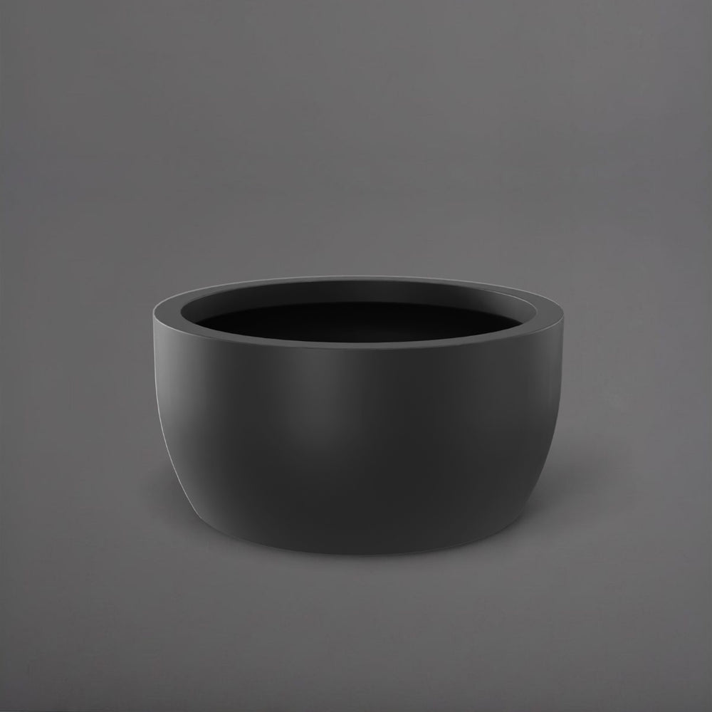 Casablanca Bowl Fiberglass Planter in matte charcoal against gray background.