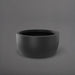 Casablanca Bowl Fiberglass Planter in matte charcoal against gray background.