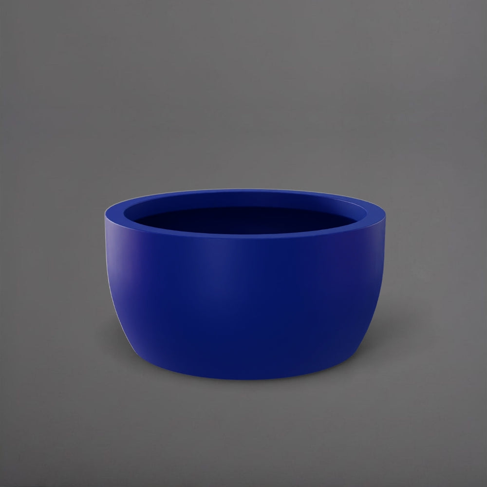 Casablanca Bowl Fiberglass Planter in matte cobalt blue against gray background.