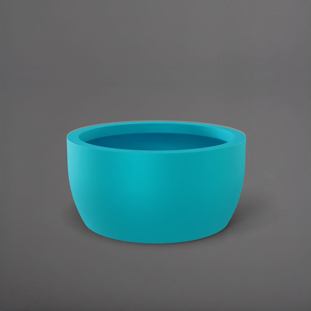 Casablanca Bowl Fiberglass Planter in satin seafoam green against gray background.