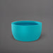 Casablanca Bowl Fiberglass Planter in satin seafoam green against gray background.