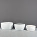 Casablanca Bowl Fiberglass Planter on concrete shown with different sizes.