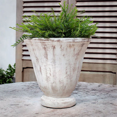 Caterine Urn - Whitewash - S/1 on table filled with plants.