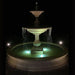 Charleston in Basin in french limestone in the backyard at night.