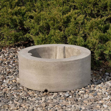 Circular Pedestal 8 Inch on gravel in the backyard.