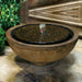 Cirrus Garden Terrace Fountain on concrete beside green plants