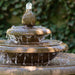 Cladridge Fountain on grass in the backyard upclose