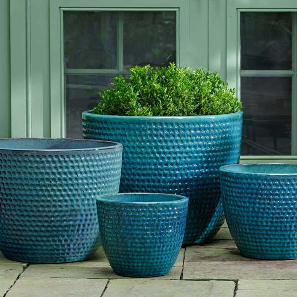 Coin Pot Planter - Aqua - S/4 on concrete filled with plants