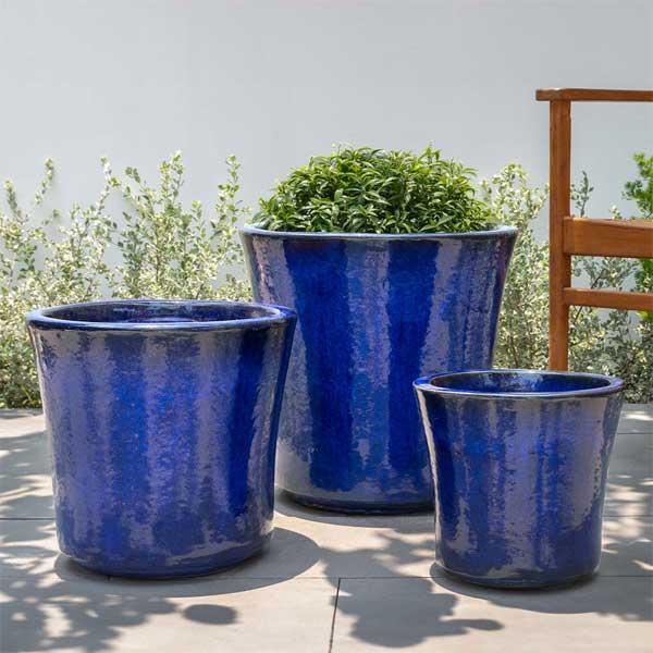 Concord Planter - Riviera Blue - S/3 on concrete filled with plants