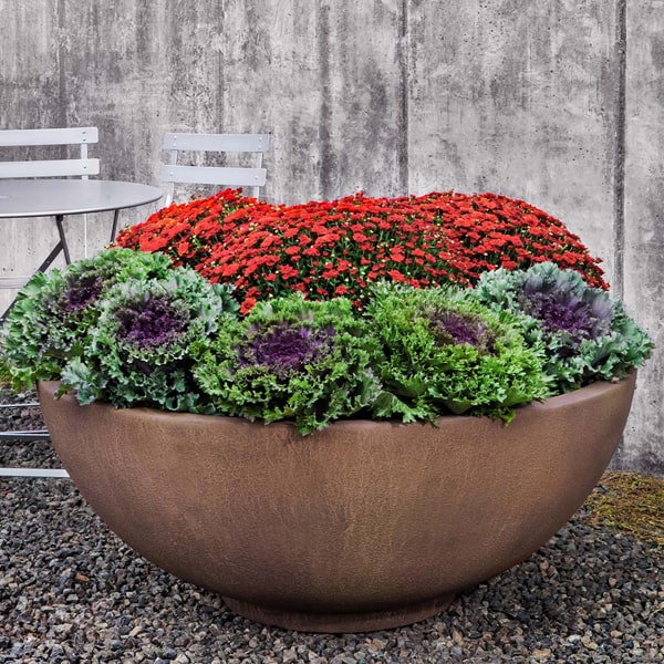 Contour Low Bowl 4719 filled with flowers in the backyard