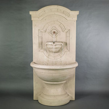 Corsica Wall Fountain against gray background.
