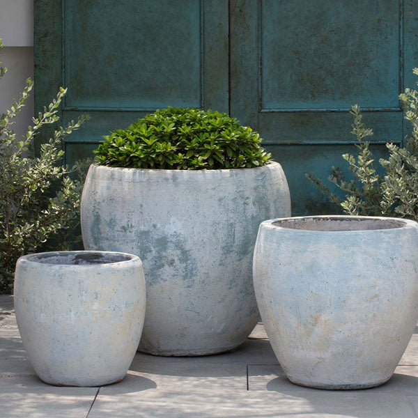 Cove Planter - Vicolo Bianco - S/3 on concrete in the backyard