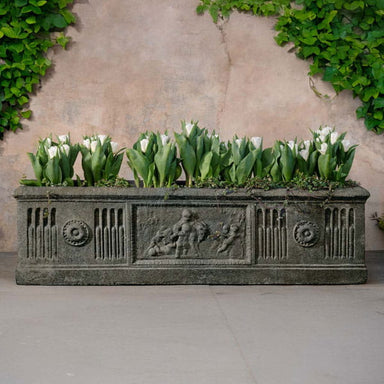 Crittenden Planter on concrete filled with plants.