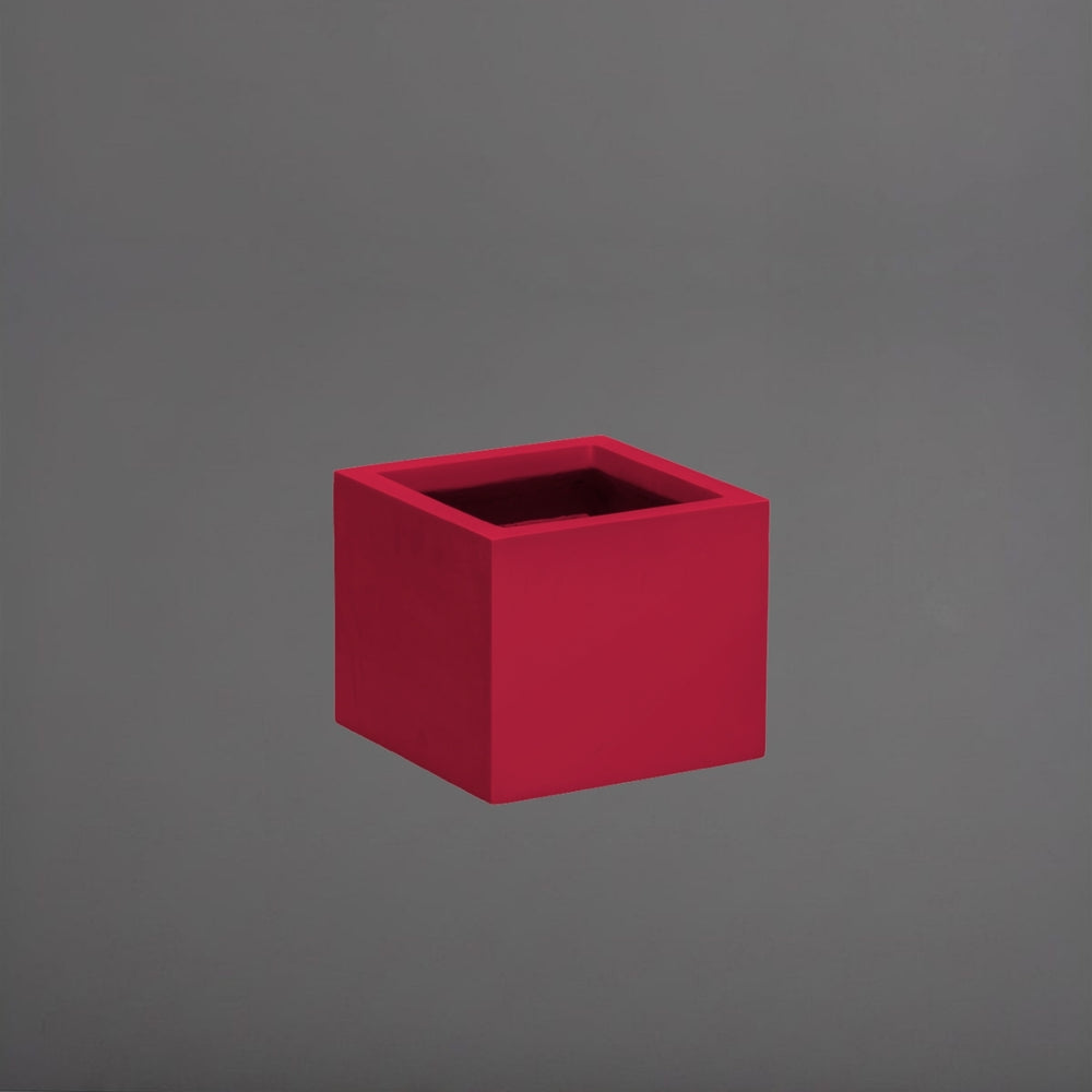 Cuba Low Corner Fiberglass Planter in gloss red against gray background.