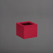 Cuba Low Corner Fiberglass Planter in gloss red against gray background.