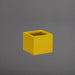 Cuba Low Corner Fiberglass Planter in gloss saffron against gray background.