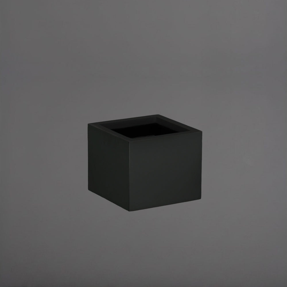 Cuba Low Corner Fiberglass Planter in matte black against gray background.