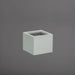Cuba Low Corner Fiberglass Planter in matte cement grey against gray background.