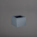 Cuba Low Corner Fiberglass Planter in matte charcoal against gray background.