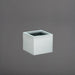 Cuba Low Corner Fiberglass Planter in metallic silver against gray background.