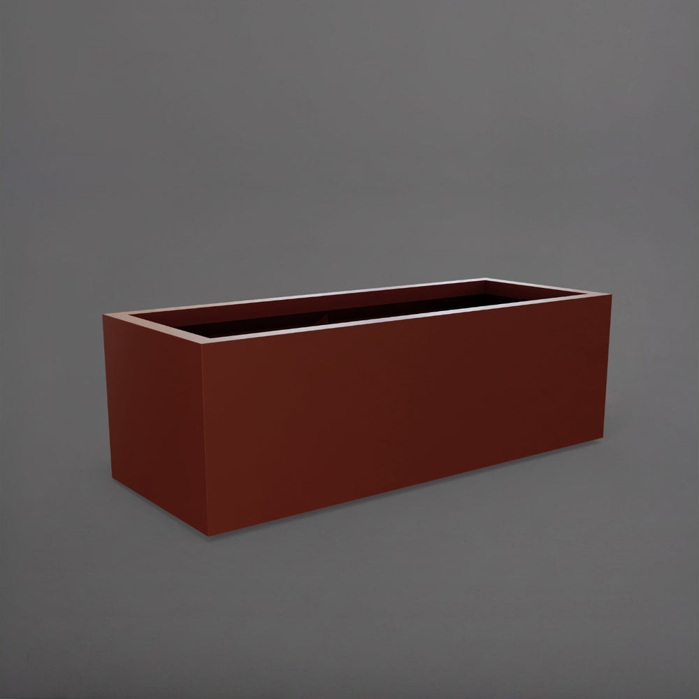 Cuba Low Rectangle Fiberglass Planter in matte terra cotta against gray background.