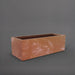 Cuba Low Rectangle Fiberglass Planter in metallic bronze against gray background.