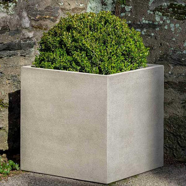 Cube Series Planter, Small filled with plants in the backyard.