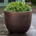 Danilo Planter Extra Large in rust lite on concrete in the backyard.