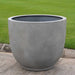 Danilo Planter, Medium in stone grey lite on concrete in the backyard.