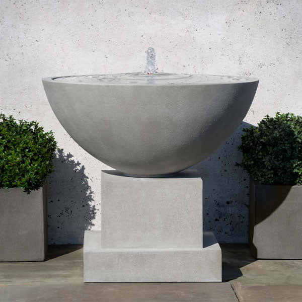 Darien Plinth Fountain on concrete in the backyard