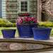 Darrowby Planter - Riviera Blue - S/3 on ledge in the backyard