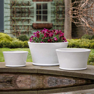 Darrowby Planter - White - S/3 on ledge in the backyard