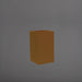 Darwin Tall Corner Fiberglass Planter in metallic bronze against gray background.