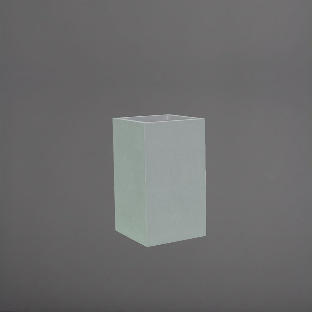 Darwin Tall Corner Fiberglass Planter in metallic silver against gray background.