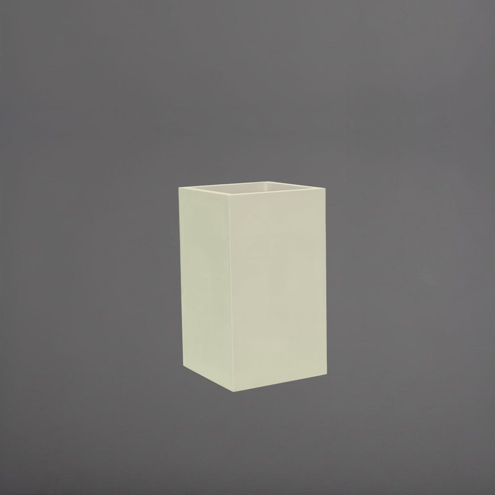 Darwin Tall Corner Fiberglass Planter in satin beige against gray background.