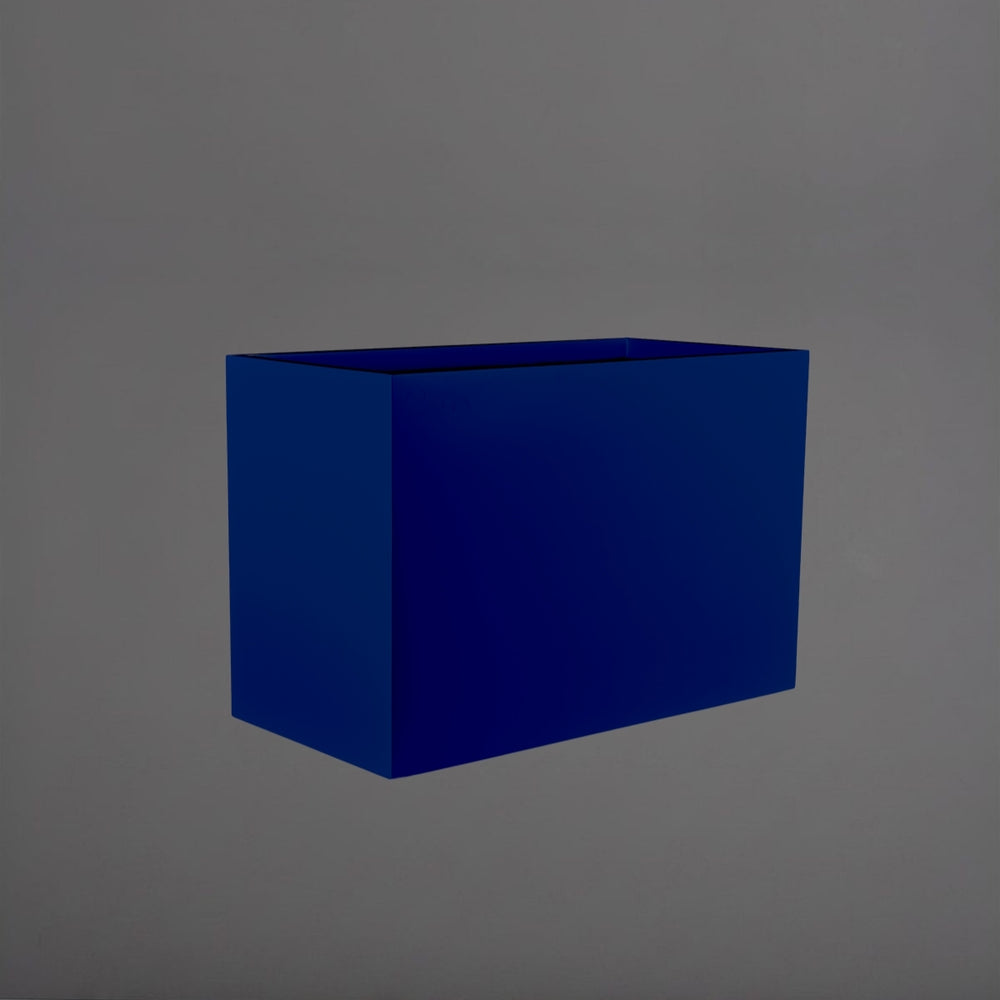 Darwin Tall Rectangle Fiberglass Planter in matte cobalt blue against gray background.