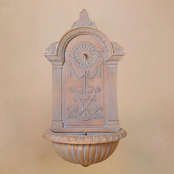 Delfino Wall Fountain against brown background.