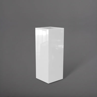 Delray Tall Corner Fiberglass Planter in gloss bright white against gray background.