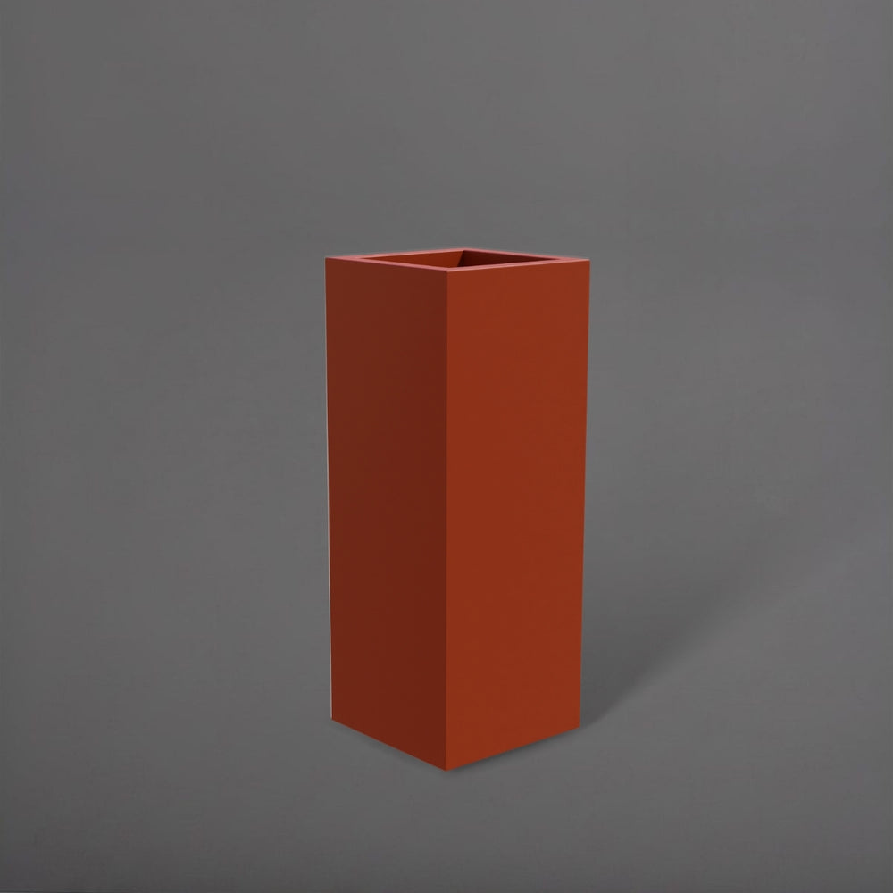 Delray Tall Corner Fiberglass Planter in matte terra cotta against gray background.