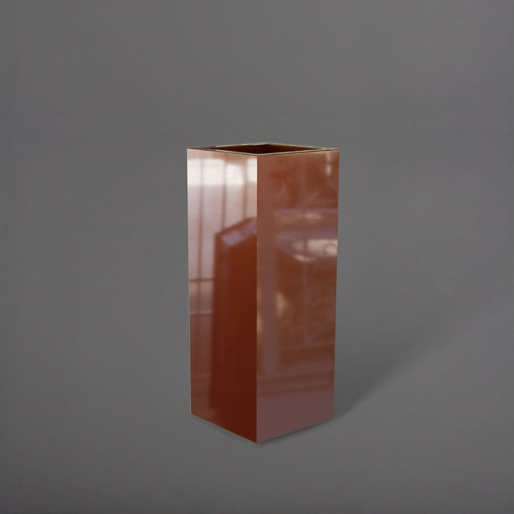 Delray Tall Corner Fiberglass Planter in metallic bronze against gray background.