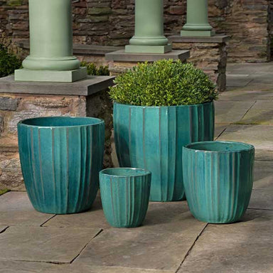 Dunes Planter - Glacier Green - S/4 on concrete filled with plants