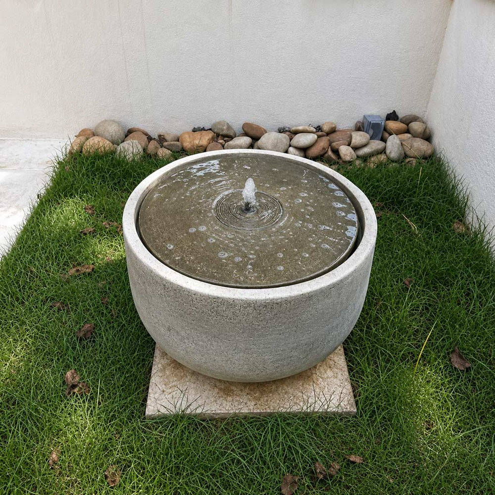 Echo Park Fountain in action on grass.