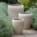 Ellesmere Planter - Cream - S/3 on concrete in the backyard.